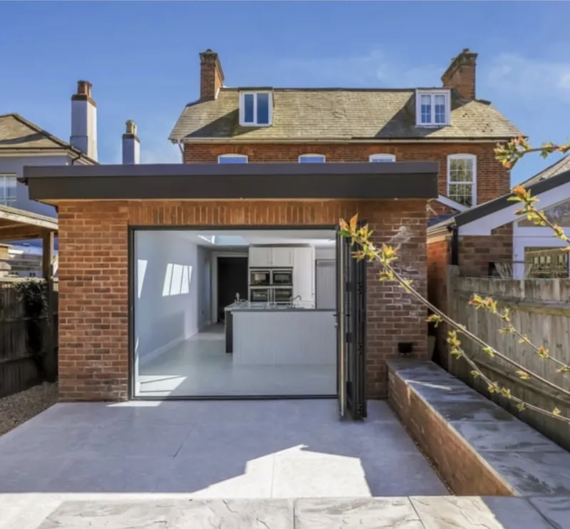 Brick rear extension with glazed doors on a Victorian house